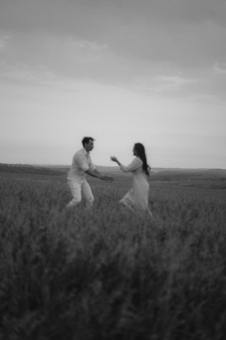 a couple dancing in a field