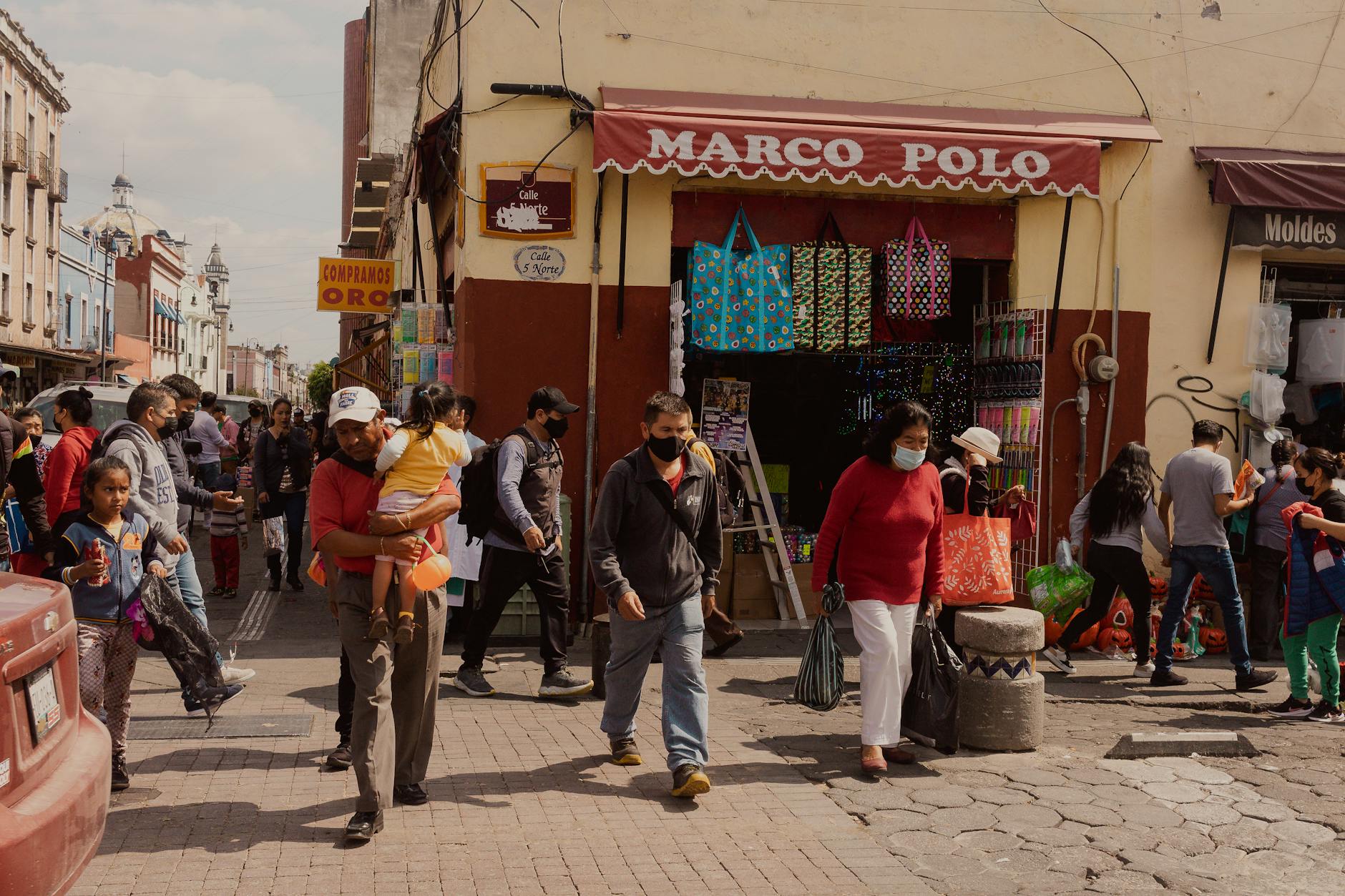 people near store in puebla