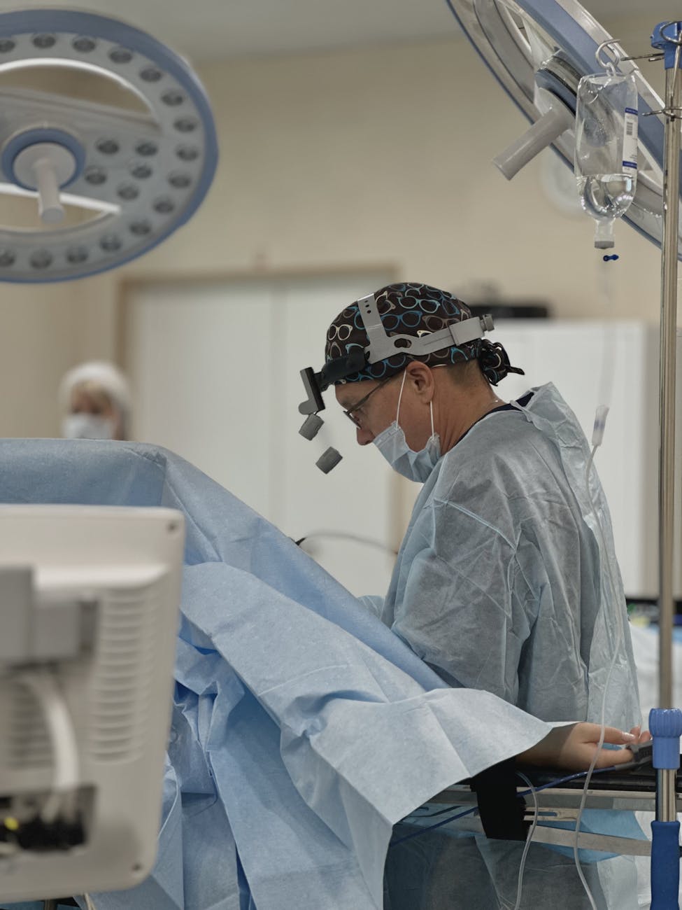 surgeon performing operation in operating room