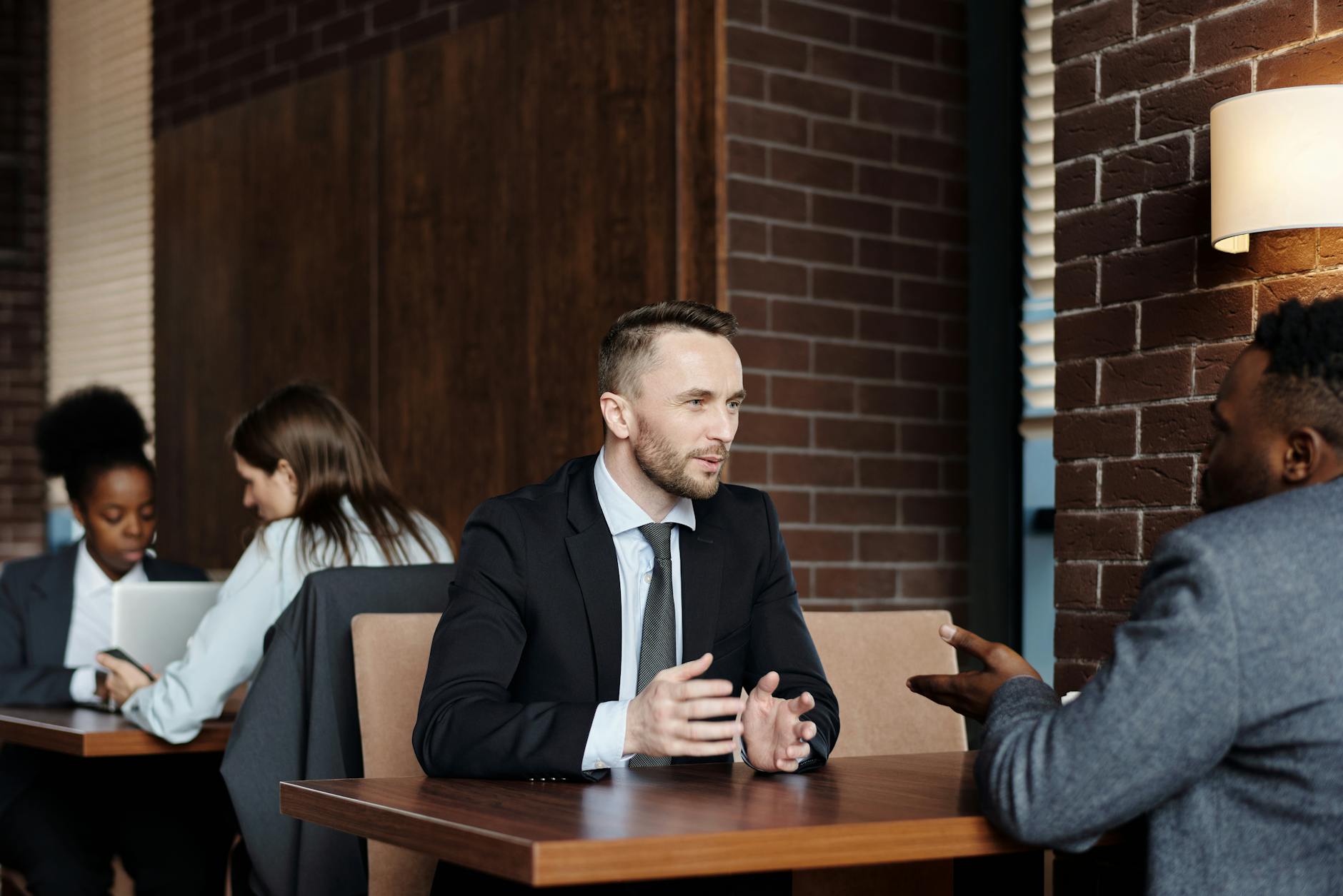 businessmen talking at a cafe