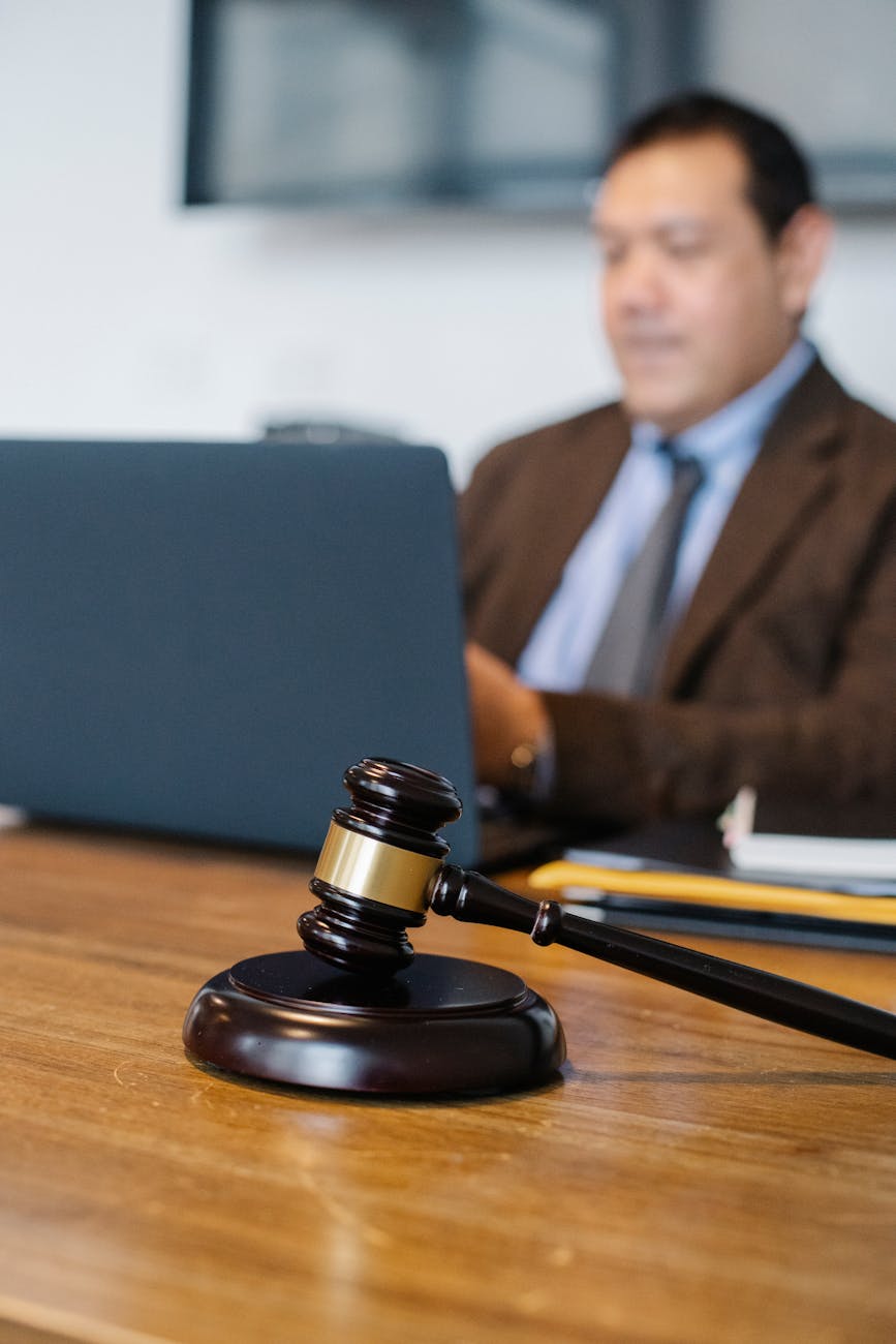 male lawyer working on laptop in office