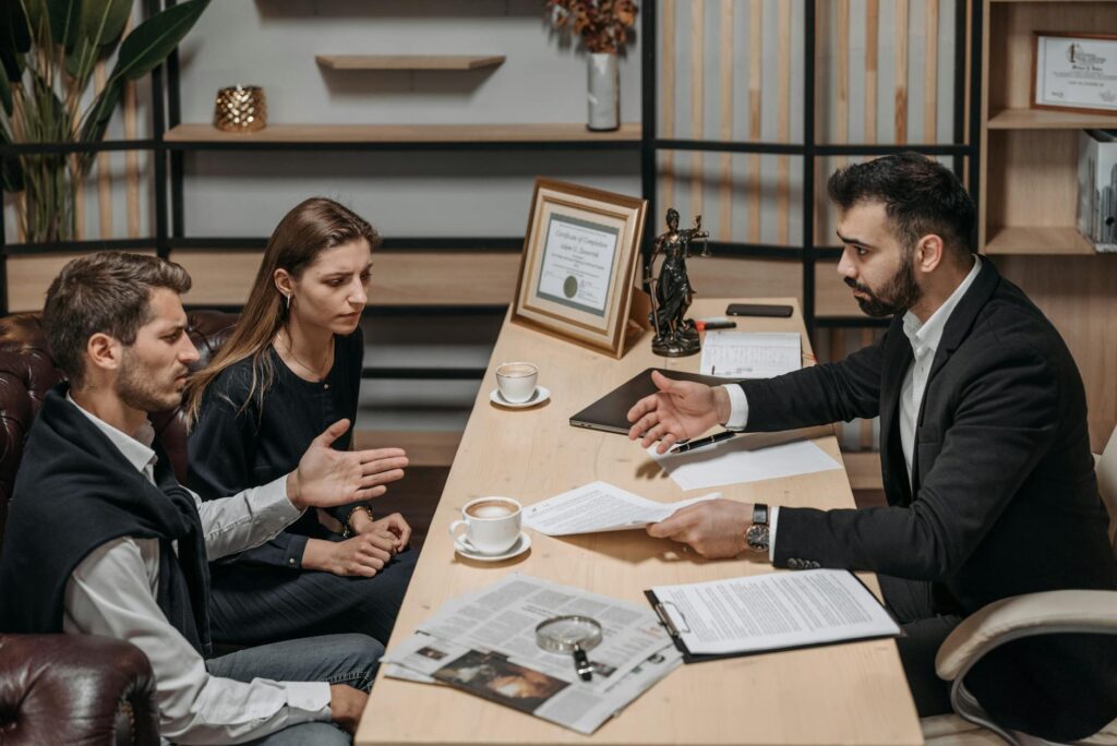 male lawyer talking to his clients