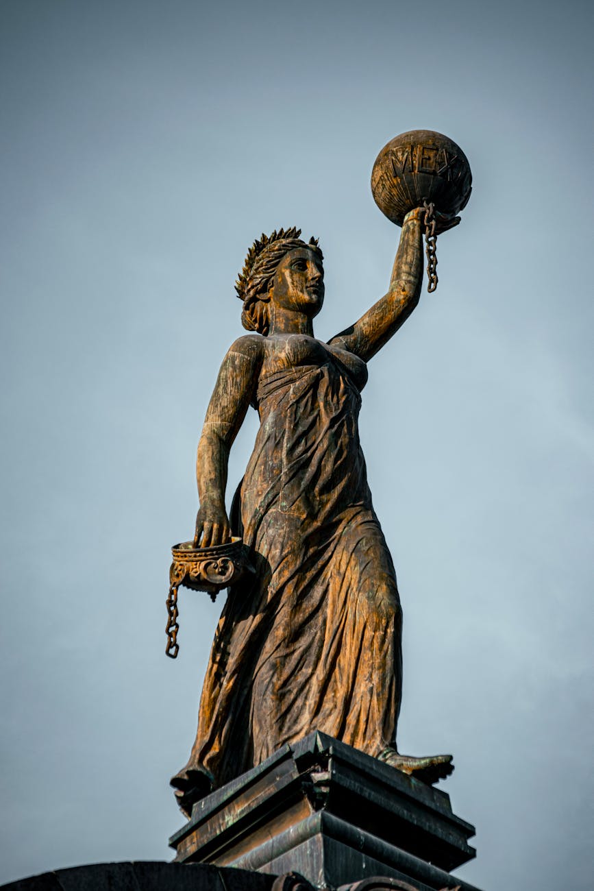 statue of justice in monterrey under blue sky
