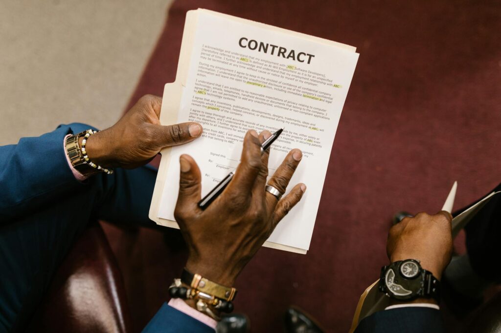 close up shot of a person holding a contract